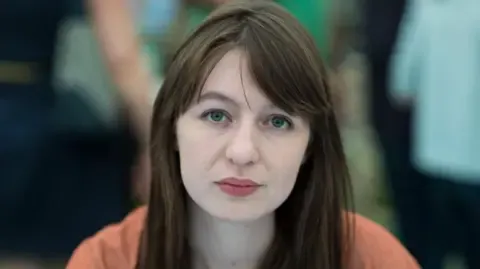 Sally Rooney claims she cannot travel to the UK over potential arrest